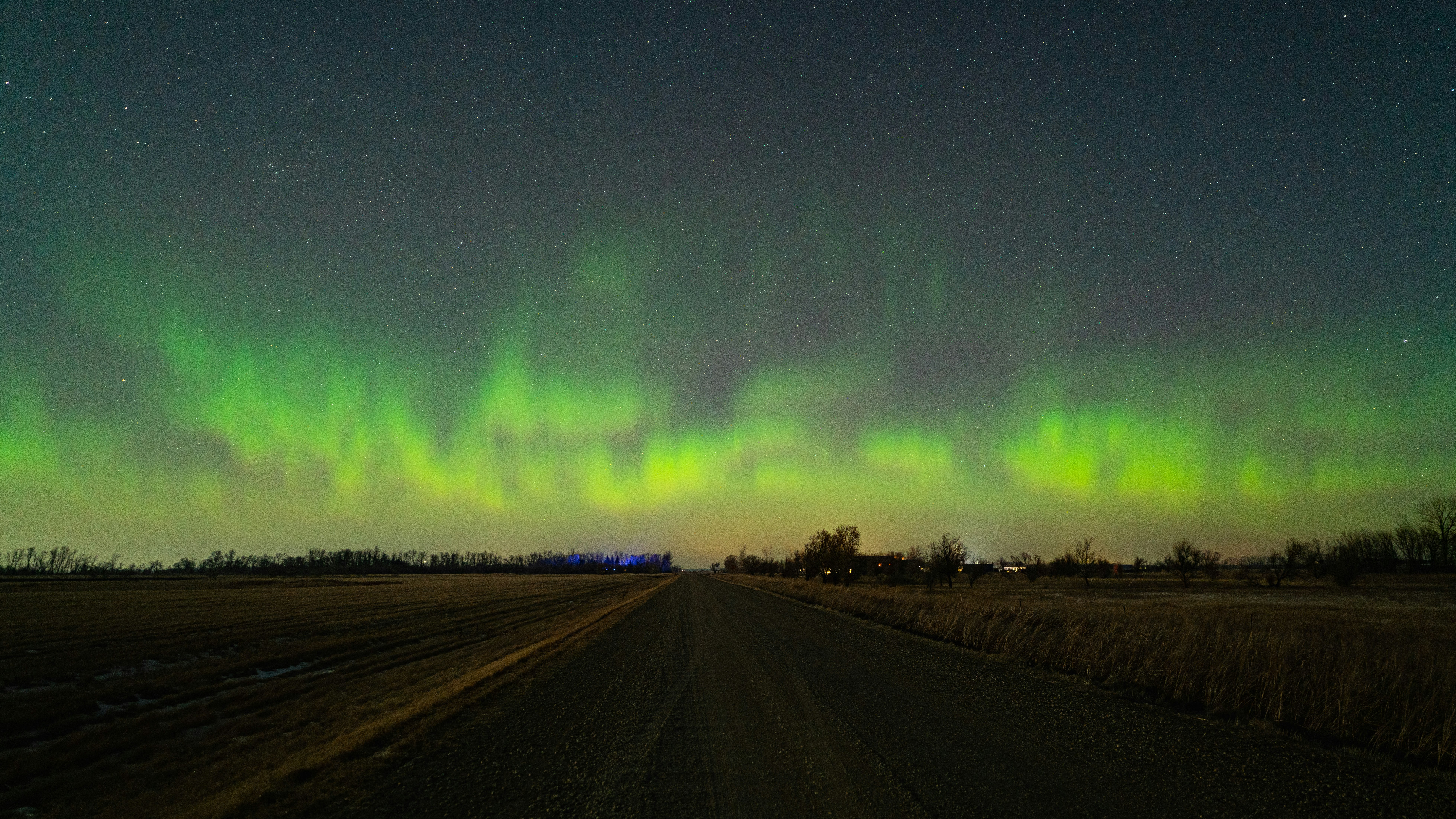 green aurora lights on road during night time